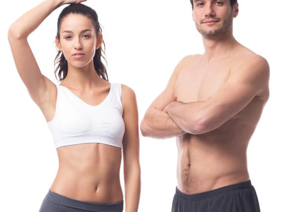 Emsculpt models, a woman and a man with toned midsections, standing against a white backdrop