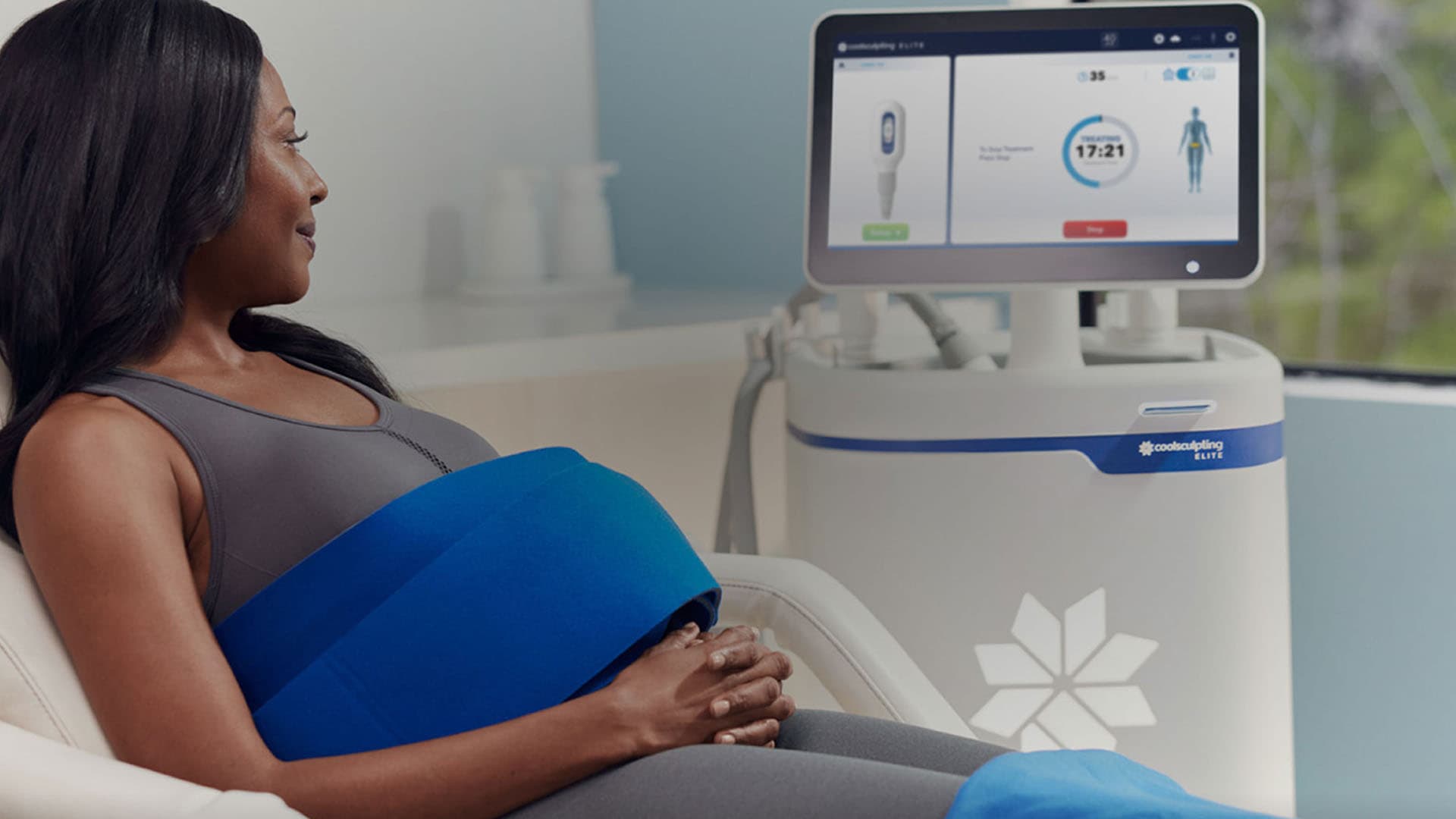 Patient relaxing during a CoolSculpting Elite session at The Dermatology, Laser and Vein Center