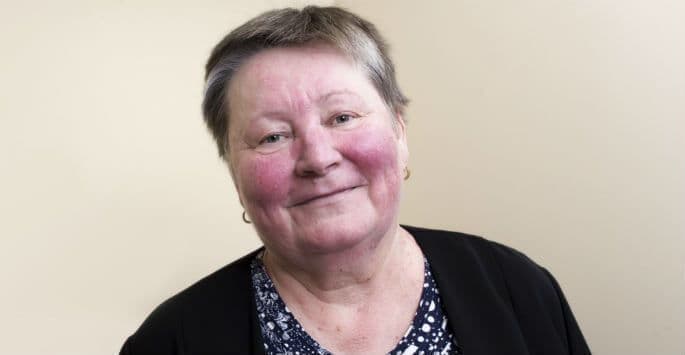 Woman with visible facial redness and flushing across the cheeks, common rosacea symptoms treated at The Dermatology, Laser & Vein Center in Cincinnati
