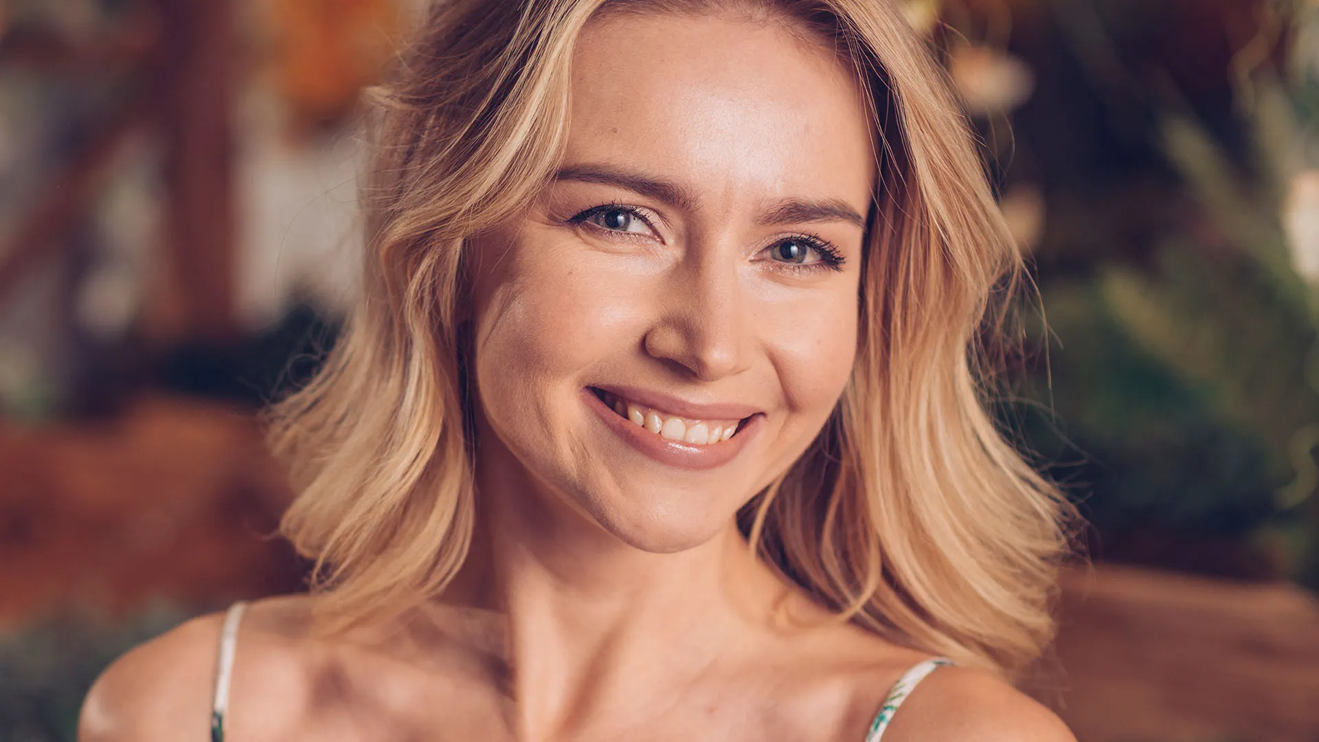 Smiling patient of The Dermatology, Laser & Vein Center with healthy skin