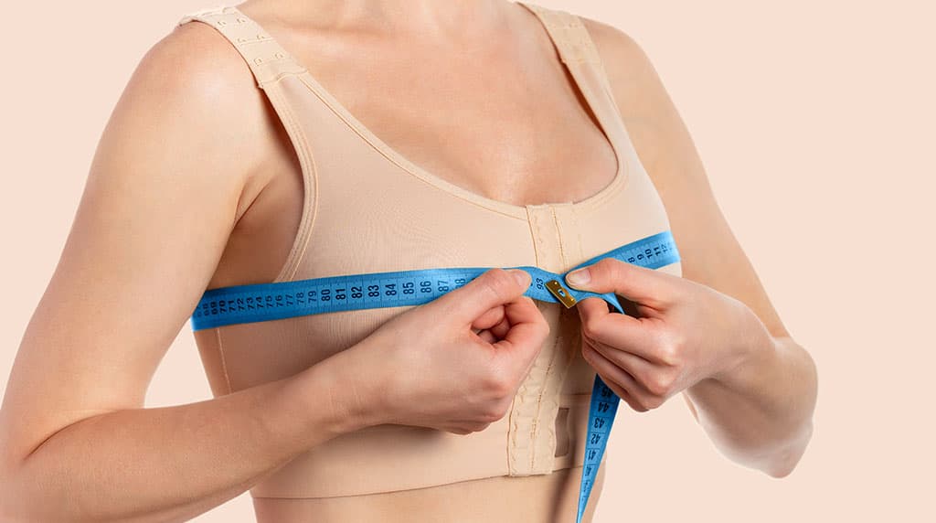 Supportive surgical bra worn during breast reduction recovery