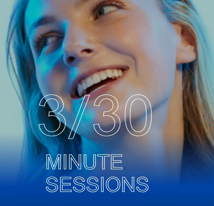 Smiling young woman in cool blue light beside the AviClear three-session treatment graphic