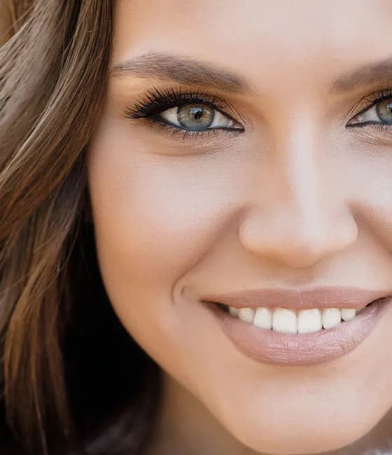 Woman with refreshed, lifted facial contours after facial rejuvenation