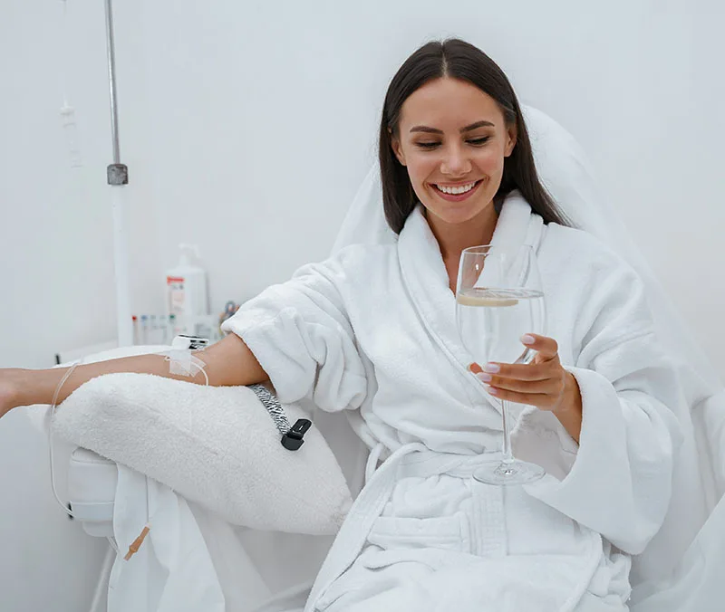 Patient relaxing in a treatment chair while receiving an IV infusion