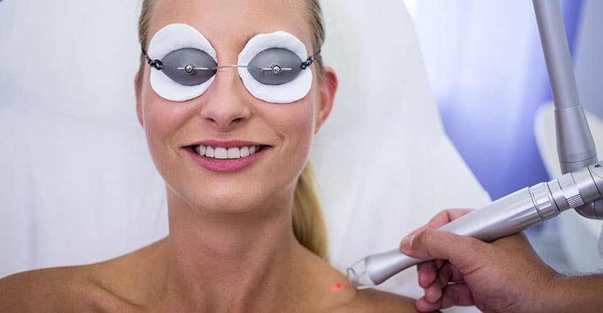 Patient wearing protective eye shields during a YAG laser treatment