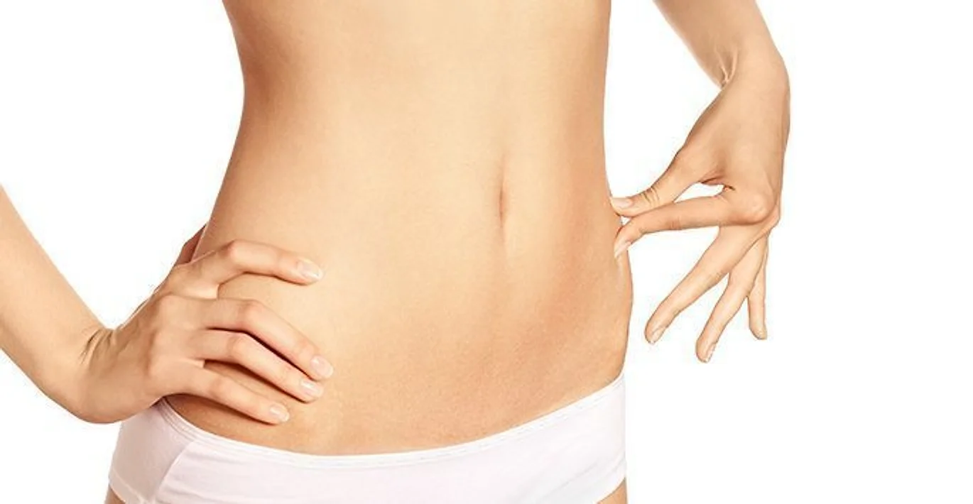 Close view of a toned abdomen, representing Smart Lipo laser-assisted liposuction
