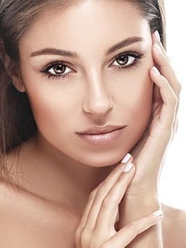 Woman with a smooth, relaxed forehead touching her cheek